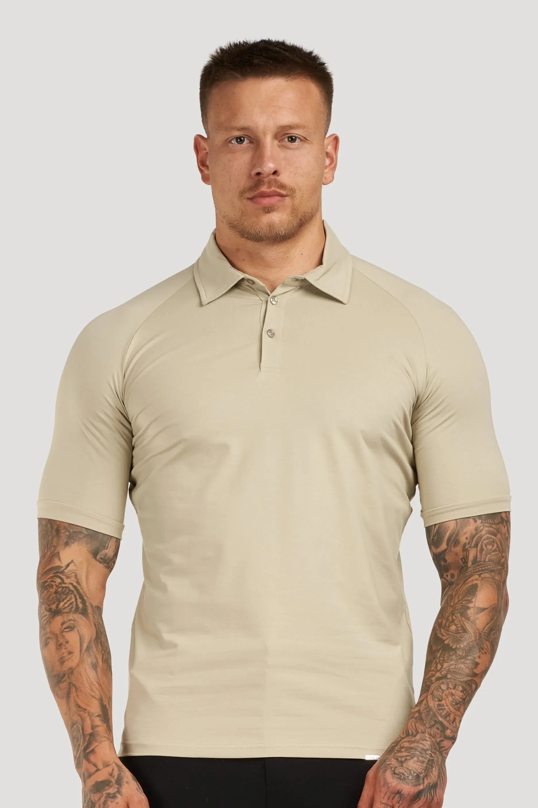 THE MUSCLE BUTTON POLO